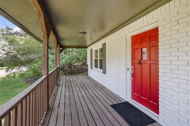 wooden terrace featuring a porch