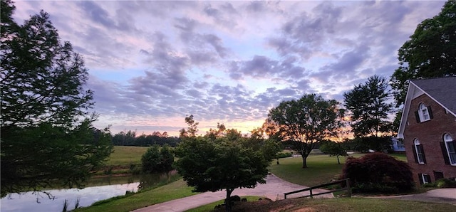 view of home's community featuring a lawn