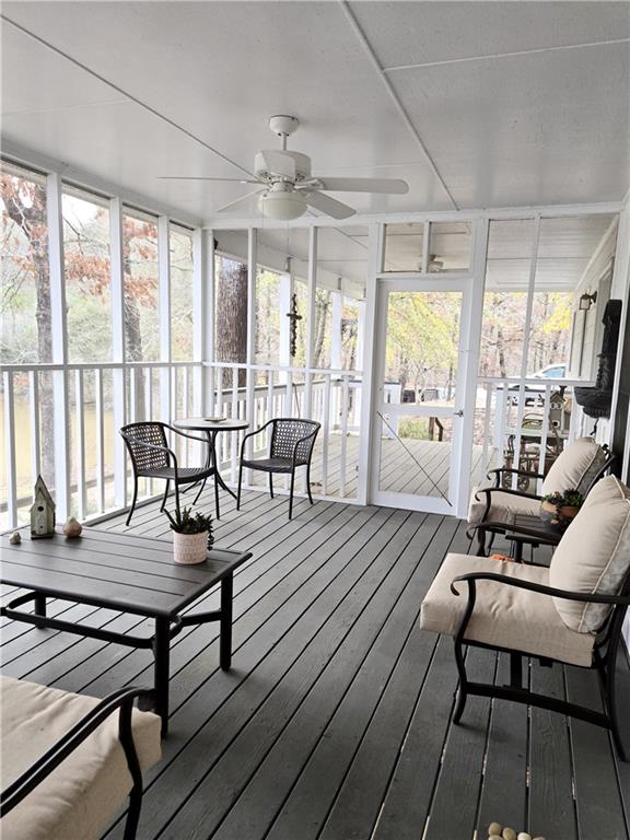 sunroom with a ceiling fan