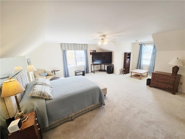 carpeted bedroom featuring a ceiling fan and lofted ceiling