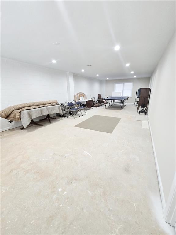 interior space with recessed lighting, baseboards, and concrete floors