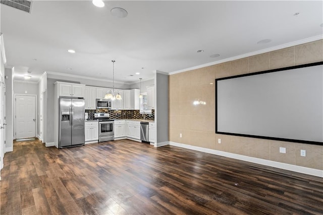 kitchen with visible vents, ornamental molding, appliances with stainless steel finishes, dark wood-style floors, and white cabinets