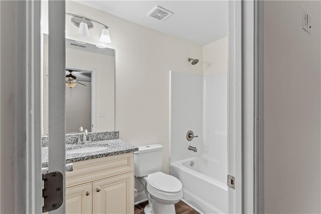 full bath featuring vanity, shower / tub combination, toilet, and visible vents