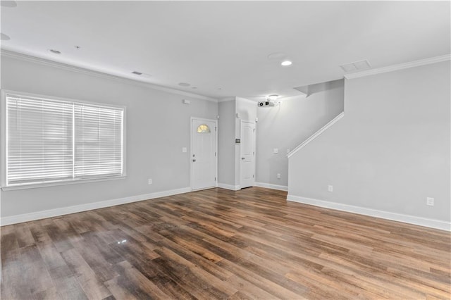 unfurnished living room with recessed lighting, wood finished floors, baseboards, and ornamental molding