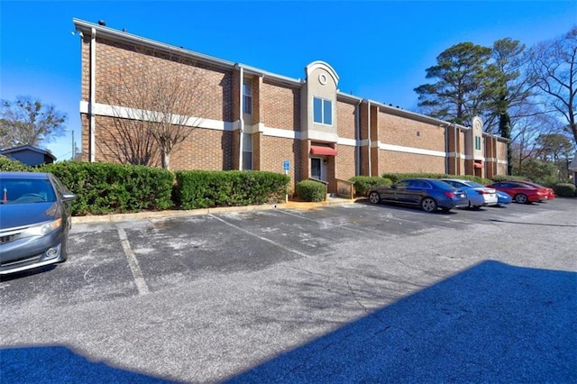 view of property with uncovered parking