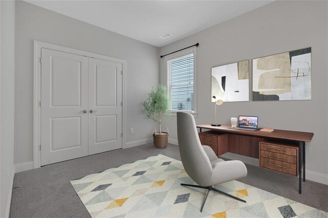 office area featuring light colored carpet