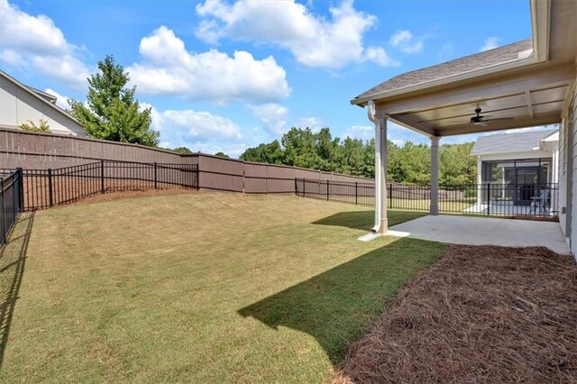 view of yard featuring a patio and ceiling fan