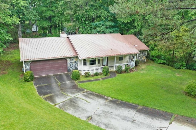 1757 Mystery Cir SW, Conyers, GA 30094 - ranch-style home featuring covered porch, a front lawn, a garage, metal roof, and a chimney