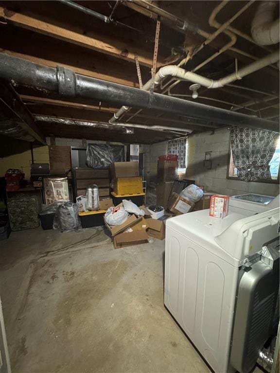 basement with washing machine and clothes dryer