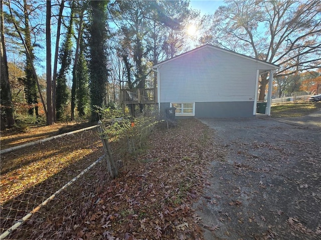 view of side of property featuring a deck