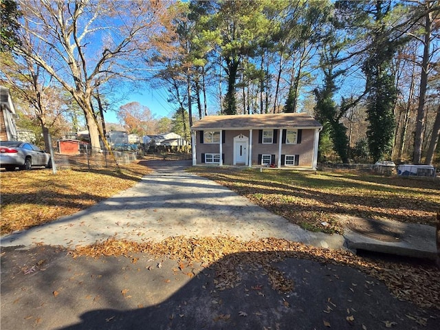 raised ranch featuring an outbuilding