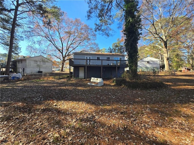 back of property featuring a deck