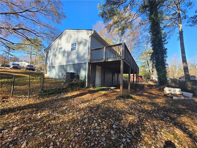 view of home's exterior featuring a wooden deck and central AC