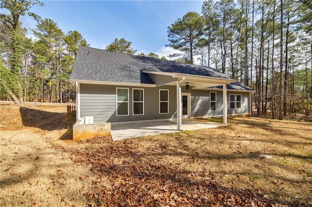 back of house with a patio, roof with shingles, and ceiling fan