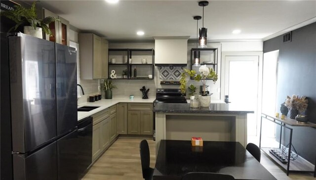 kitchen featuring visible vents, stainless steel appliances, tasteful backsplash, a sink, and open shelves