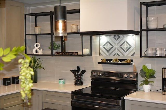 kitchen featuring gray cabinetry, range with electric cooktop, custom exhaust hood, and tasteful backsplash