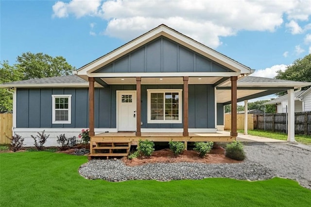 598 Taylor Dr SE, Smyrna, GA 30080 - view of front facade with board and batten siding, a porch, and a shingled roof