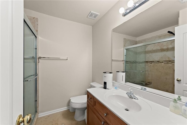 full bath with visible vents, toilet, a stall shower, baseboards, and vanity