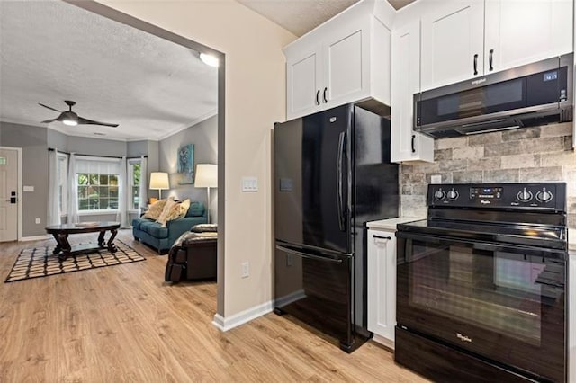 kitchen with white cabinetry, ceiling fan, light wood-type flooring, backsplash, and black appliances