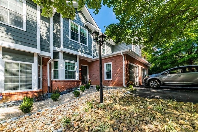 view of side of home featuring a garage