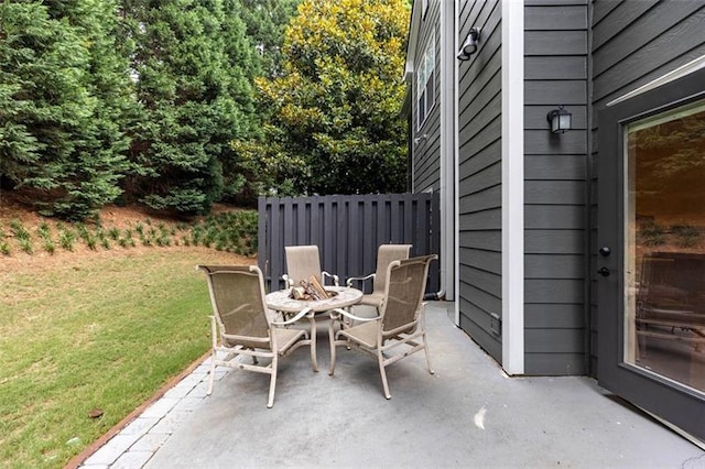 view of patio with a fire pit