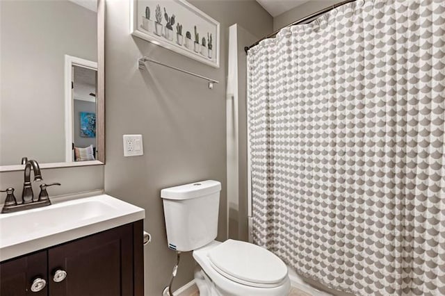 bathroom with toilet and vanity