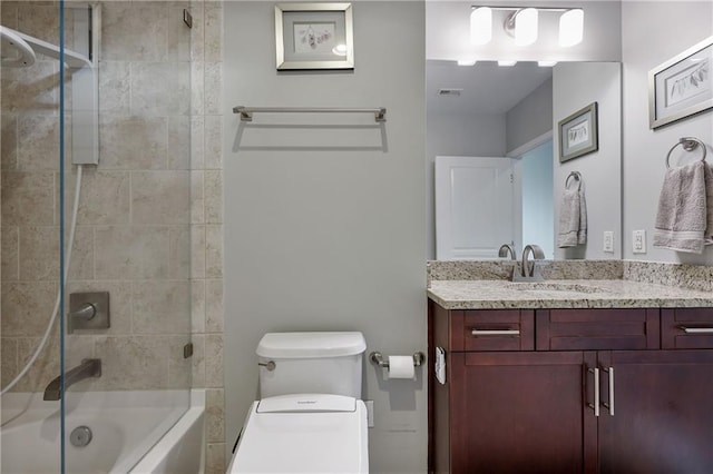 full bathroom featuring visible vents, vanity, toilet, and  shower combination