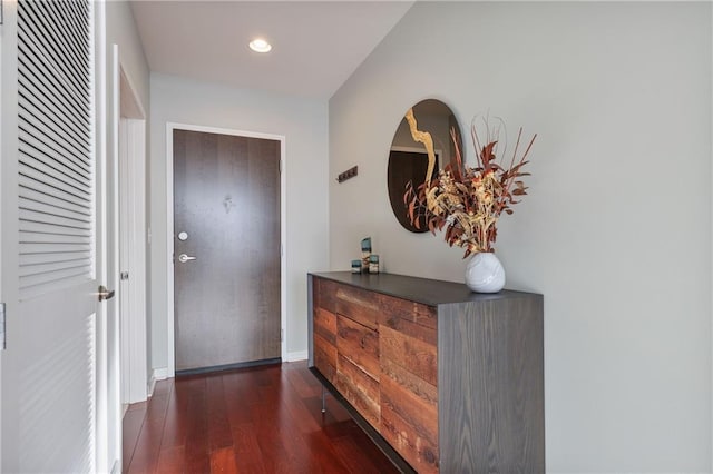 entrance foyer with recessed lighting, dark wood-style flooring, and baseboards