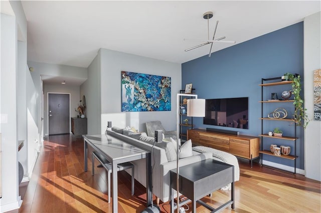 living room featuring baseboards and wood finished floors