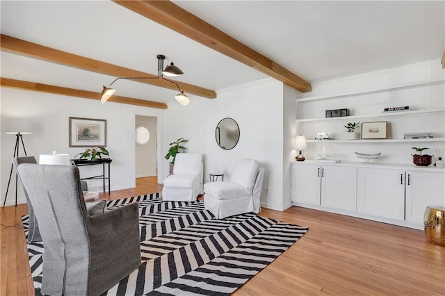 living room featuring light wood-style floors and beam ceiling