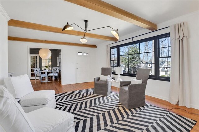 sitting room featuring a wealth of natural light and hardwood / wood-style floors