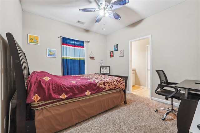 bedroom featuring baseboards, visible vents, ensuite bath, ceiling fan, and carpet flooring