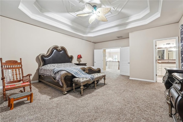 bedroom with carpet flooring, crown molding, and a raised ceiling