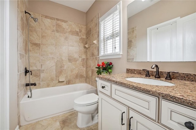 bathroom with vanity, shower / tub combination, and toilet