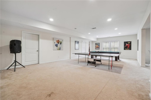 recreation room featuring baseboards, recessed lighting, visible vents, and light carpet