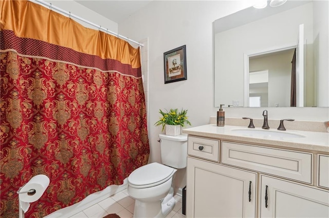 full bathroom featuring tile patterned flooring, toilet, and vanity