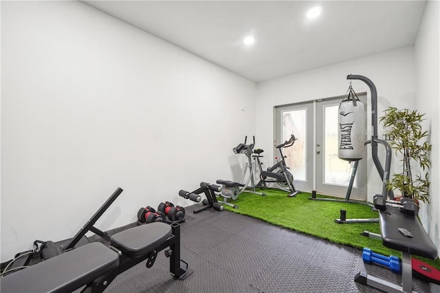 exercise area featuring recessed lighting and french doors