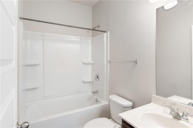 full bathroom featuring shower / bathing tub combination, vanity, and toilet