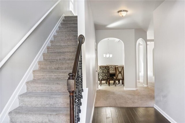 stairs with wood-type flooring