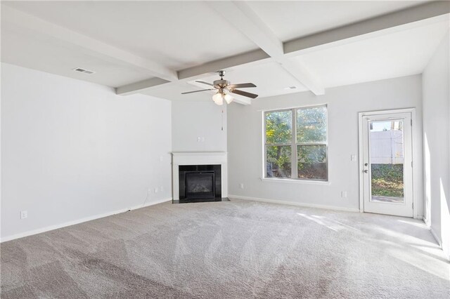 unfurnished living room featuring beam ceiling, light colored carpet, and ceiling fan