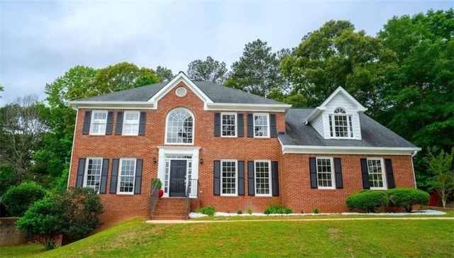 1200 Larson Ln SW, Marietta, GA 30064 - colonial-style house featuring a front yard and brick siding