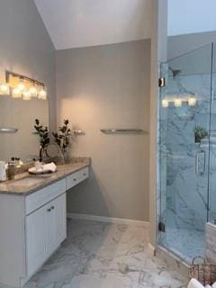 1200 Larson Ln SW, Marietta, GA 30064 - bathroom featuring a marble finish shower, marble look tile flooring, vanity, baseboards, and lofted ceiling