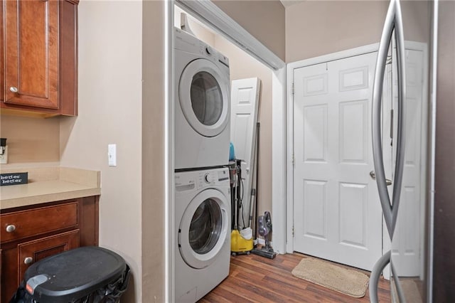40 Brickton Way E, Dawsonville, GA 30534 - laundry room featuring stacked washer and clothes dryer and dark wood-type flooring