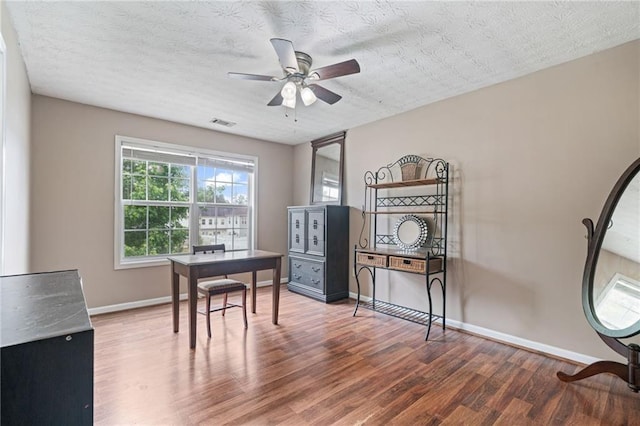 40 Brickton Way E, Dawsonville, GA 30534 - office with wood finished floors, ceiling fan, and a textured ceiling