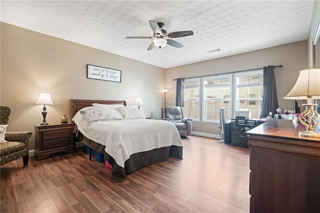 40 Brickton Way E, Dawsonville, GA 30534 - bedroom featuring dark wood-style floors, ceiling fan, and a textured ceiling