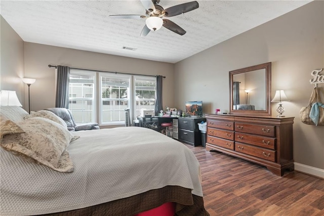 40 Brickton Way E, Dawsonville, GA 30534 - bedroom with dark wood-style floors, a textured ceiling, and a ceiling fan