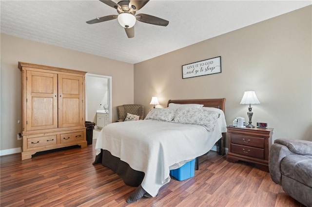 40 Brickton Way E, Dawsonville, GA 30534 - bedroom featuring dark wood finished floors, ensuite bathroom, and a ceiling fan