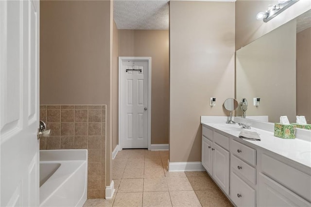 40 Brickton Way E, Dawsonville, GA 30534 - bathroom with double vanity, a garden tub, tile patterned flooring, and a textured ceiling
