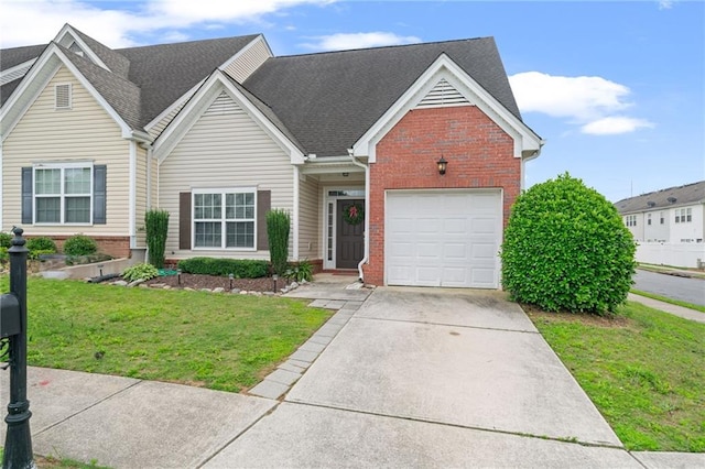 40 Brickton Way E, Dawsonville, GA 30534 - traditional home with brick siding, a front yard, a shingled roof, and concrete driveway