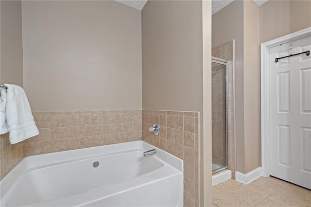 40 Brickton Way E, Dawsonville, GA 30534 - full bath featuring a bath, a shower stall, and tile patterned floors